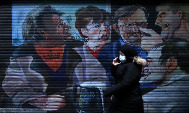 A woman walks past a closed shop in the city centre ahead of today's spring budget announcement amid the coronavirus disease (COVID-19) crisis, in Middlesbrough, Britain, March 3, 2021. (Photo by Lee Smith/Reuters)