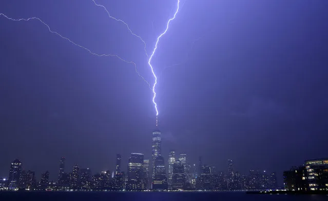 A lightning bolt strikes One World Trade Center in New York City during a thunderstorm on September 25, 2022, as seen from Jersey City, New Jersey. (Photo by Gary Hershorn/Getty Images)