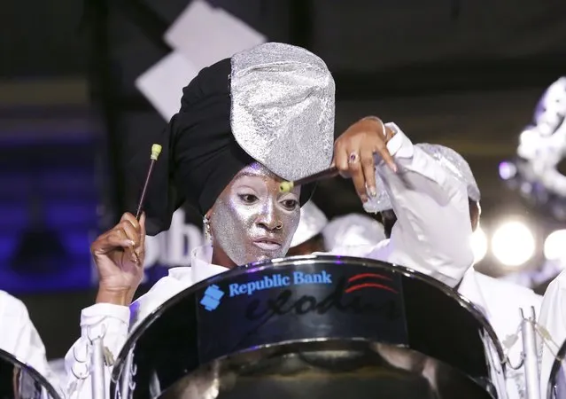 A member of the Republic Bank Exodus steelband plays “De Puna Band” in the large band category during the National Panorama finals held by the governing body Pan Trinbago at the Queen's Park Savannah in Port-of-Spain February 15, 2015. (Photo by Andrea De Silva/Reuters)