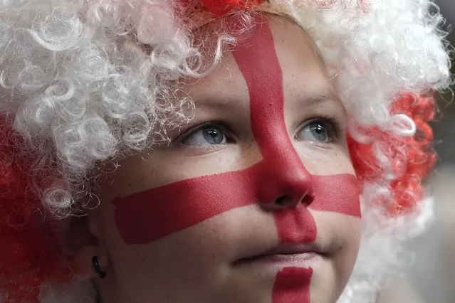 A young England fan waits ahead of the start to watch a screening of the Women's World Cup 2023 semifinal soccer match between England and Australia at BOXPARK Wembley in London, Wednesday, August 16, 2023. (Photo by Frank Augstein/AP Photo)