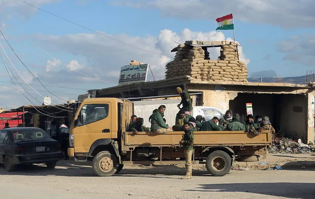 Members of the Peshmerga stand guard near Mazar Sharaf Eldin, a sacred and a cemetery area for the Yazidi minority, north of Sinjar, March 2, 2015. A number of Peshmerga were killed and others injured after two suicide car bombs attacks targeted a building the Peshmerga were using for fighting, according to Peshmerga officials.  REUTERS/Asmaa Waguih (IRAQ - Tags: POLITICS CONFLICT MILITARY CIVIL UNREST)