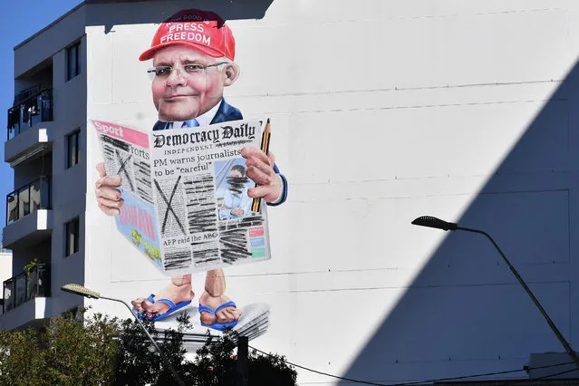 A mural depicting Australian Prime Minister Scott Morrison is seen near Central Station in Sydney, Thursday, May 13, 2021. (Photo by Dean Lewins/AAP Image)