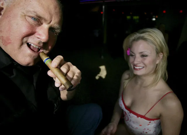 In this April 7, 2005, file photo, Moonlite Bunny Ranch owner Dennis Hoff smokes a cigar at his brothel's entrance in Mound House, Nev. Hof, a legal pimp who has fashioned himself as a Donald Trump-style Republican candidate has died, Nevada authorities said Tuesday, October 16, 2018. (Photo by Brad Horn/AP Photo)