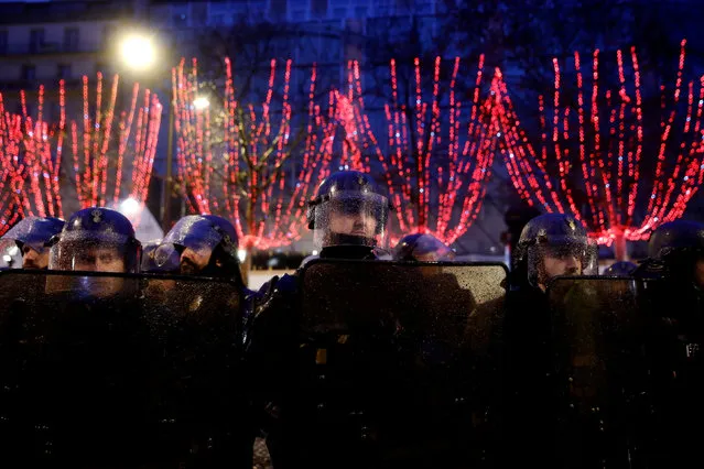 French gendarmes stand guard during a demonstration by the “yellow vests” movement in Paris, France, December 15, 2018. (Photo by Gonzalo Fuentes/Reuters)