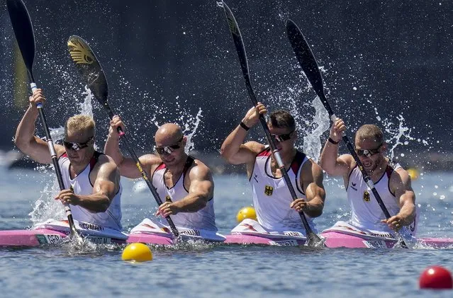 Max Rendschmidt, Ronald Rauhe, Tom Liebscher and Max Lemke of Germany compete in the men's kayak four 500m heat during the 2020 Summer Olympics, Friday, August 6, 2021, in Tokyo, Japan. (Photo by Kirsty Wigglesworth/AP Photo)