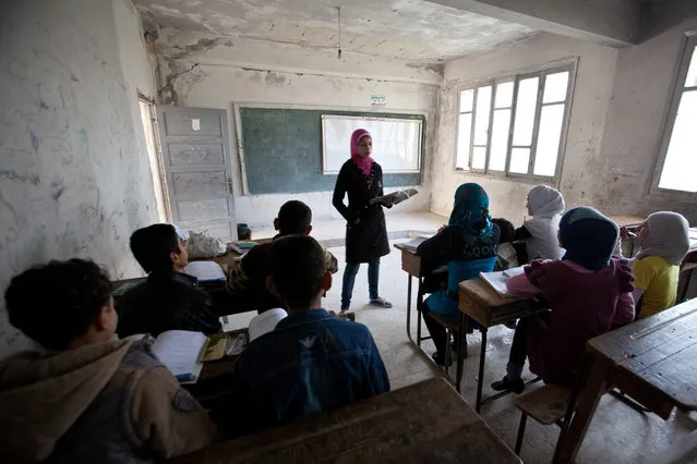 Classes coninue at the school in Adthar, a village under opposition control in Idlib province, Syria, on November 19, 2012. The school was closed for safety reasons, but has since been reopened. (Photo by Bradley Secker/Demotix)