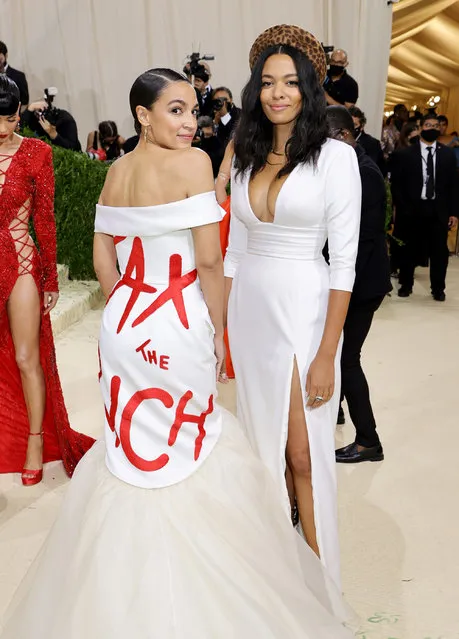 American politician and activist Alexandria Ocasio-Cortez (L) attends The 2021 Met Gala Celebrating In America: A Lexicon Of Fashion at Metropolitan Museum of Art on September 13, 2021 in New York City. (Photo by Mike Coppola/Getty Images)