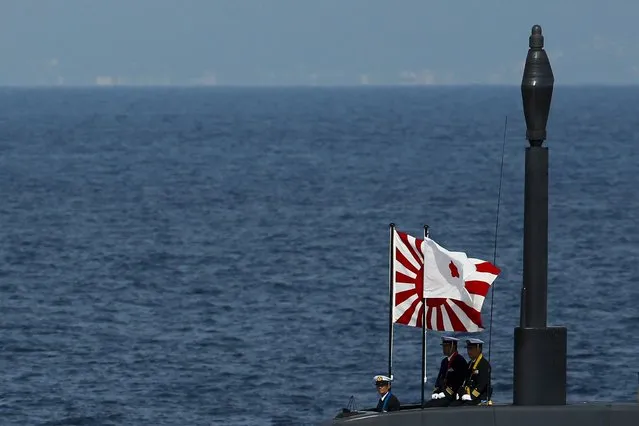 Officers stand aboard a Soryu submarine of the Japanese Maritime Self-Defense Force (JMSDF) during a fleet review at Sagami Bay, off Yokosuka, south of Tokyo in this October 15, 2015 file photo. Japan has enlisted electronics firm Toshiba Corp to help it try to win Asia's biggest defense contract, a A$50 billion ($36 billion) deal to build a dozen submarines for Australia, three sources said. (Photo by Thomas Peter/Reuters)