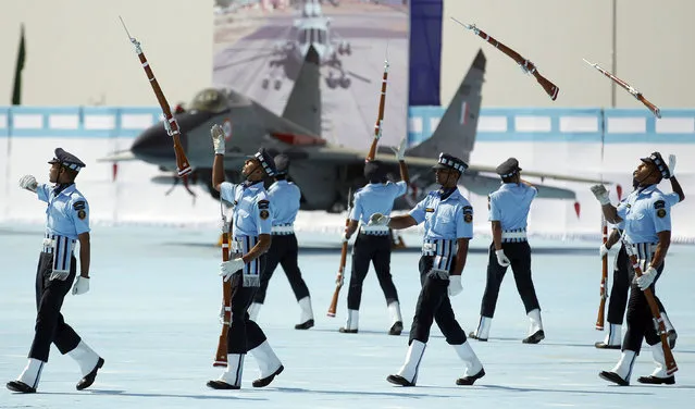 Air warrior drill team perform in front of a MIG-29 aircraft during the President's Standard Presentation (PSP) held at Jamnagar Air Force Station in the western state of Gujarat, India March 4, 2016. (Photo by Amit Dave/Reuters)