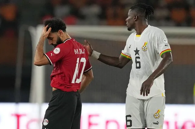 Egypt's Mohamed Salah, left, leaves the field after sustaining an injury during the African Cup of Nations Group B soccer match between Egypt and Ghana in Abidjan, Ivory Coast, Thursday, January 18, 2024. (Photo by Themba Hadebe/AP Photo)