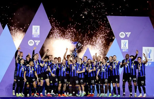 Inter Milan's Lautaro Martinez lifts the trophy with teammates after winning the Supercoppa Italiana final against Napoli in Riyadh, Saudi Arabia on January 22, 2024. (Photo by Ahmed Yosri/Reuters)