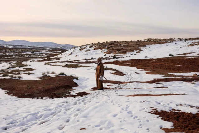 Hamza, 59, a mountaineer is seen near his house on the outskirts of Al Bayadh in the high steppe region of south western Algeria January 26, 2017. In a special weather bulletin, Algeria's National Meteorological Office since mid-January has been announcing heavy rains for central and eastern cities, and snowstorms for mountainous regions that have cut off roads and isolated homes in remote rural areas. (Photo by Zohra Bensemra/Reuters)