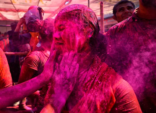 Hindu devotees are seen playing with Colourful powders and water during the Holi Festival celebration at Gokul dham, Mathura, Uttar Pradesh, India on March 18, 2019. (Photo by Avishek Das/SOPA Images/LightRocket via Getty Images)