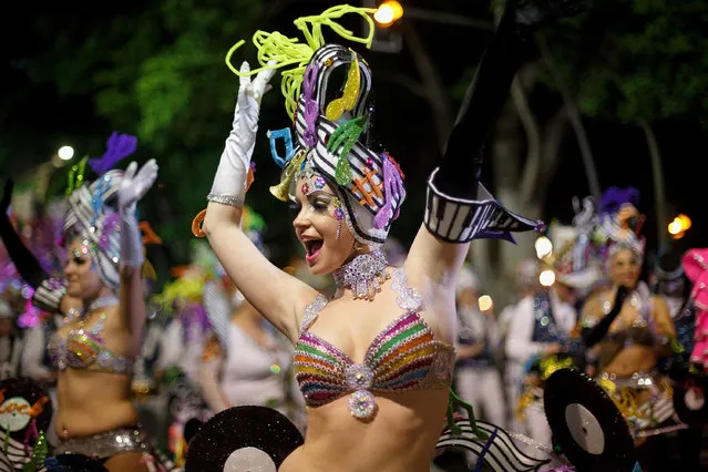 Members of 'Los Rumberos' troupe perform in the troupes dancing contest during the Santa Cruz de Tenerife Carnival on March 1, 2014 in Santa Cruz de Tenerife on the Canary island of Tenerife, Spain. (Photo by Pablo Blazquez Dominguez/Getty Images)