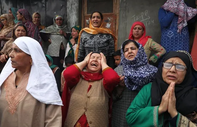 Family members and relatives of boat accident victims mourn near the accident site, as rescue operation continues, in Jhelum, the outskirts of Srinagar, the summer capital of Indian Kashmir, 16 April 2024. At least four people drowned as a boat carrying minors capsized in river Jhelum with several passengers still missing, NDRF officials said. A rescue operation was launched and the state disaster response force team was deployed. (Photo by Farooq Khan/EPA/EFE)