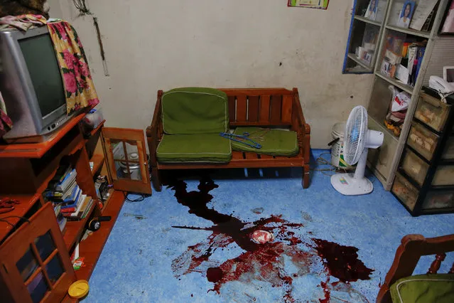 Blood remains on the floor of a room where a Noberto Maderal was killed during a drug-related police operation in Manila, Philippines October 19, 2016. (Photo by Damir Sagolj/Reuters)