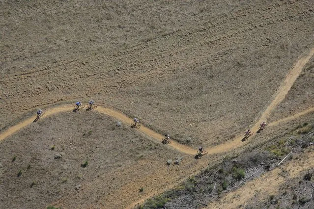 An aerial image showing riders competing in stage 6 of the annual ABSA Cape Epic mountain bike stage race, Elgin, South Africa, 29 March 2014. (Photo by Kim Ludbrook/EPA)