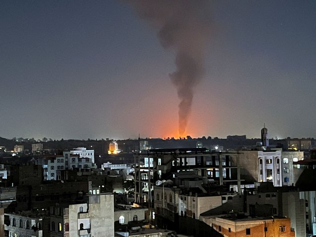 Smoke rises in the sky following U.S-led airstrikes in Sanaa, Yemen, on February 25, 2024. (Photo by Adel Al Khader/Reuters)