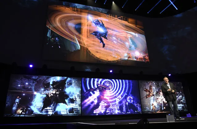 Adam Boyes, vice president of publisher and developer relations for Sony Computer Entertainment America, discusses the video game "Destiny: The Taken King" at the Sony Playstation at E3 2015 news conference at the Los Angeles Sports Arena on Monday, June 15, 2015, in Los Angeles. (Photo by Chris Pizzello/Invision/AP)
