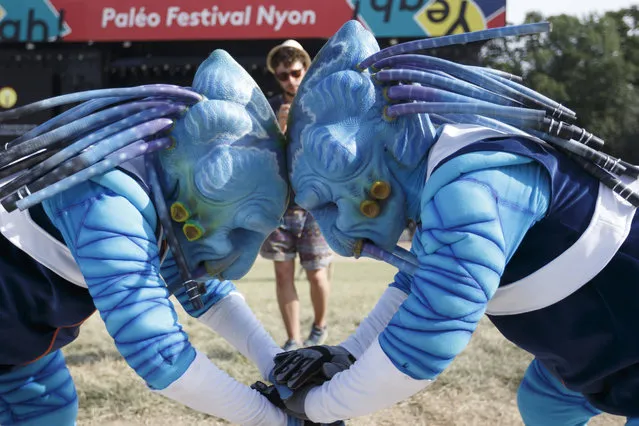 French street artists of company Qualite Street perform “Galactic” during the 44th edition of the Paleo Festival, in Nyon, Switzerland, 24 July 2019. The Paleo is an open-air music festival in the western part of Switzerland that runs from 23 to 28 July. (Photo by Salvatore Di Nolfi/EPA/EFE)