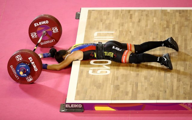 Rosive Silgado Atencio of Columbia lies on the ground after being unable to complete a lift during the women's weightlifting 59kg competition on Day 2 of the Lima 2019 Pan American Games at Mariscal Cáceres Coliseum of Chorrillos Military School on July 28, 2019 in Lima, Peru. (Photo by Ezra Shaw/Getty Images)