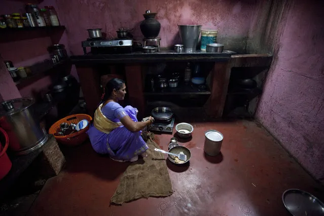 Taramati Vaghdhare, 53, works in her kitchen in Madhban village, near the proposed site of the Jaitapur nuclear plant in Ratnagiri district, about 360 km (224 miles) south of Mumbai, April 13, 2011. (Photo by Danish Siddiqui/Reuters)
