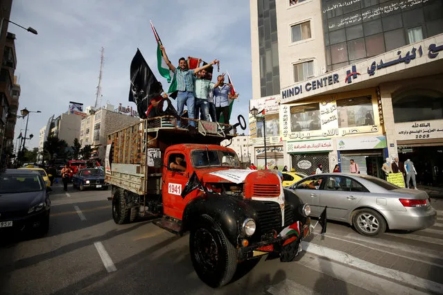 Palestinians ride atop a truck during a rally marking the 68th anniversary of Nakba in the West Bank city of Ramallah May 15, 2016. (Photo by Mohamad Torokman/Reuters)