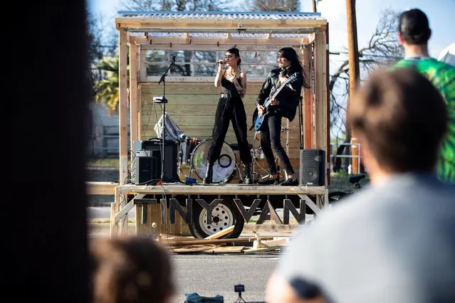 Sarah Gaugler and Paolo Perlata of Turbo Goth perform during a tiny van concert, an unofficial SXSW event, in Austin, Texas, U.S. March 14, 2022. (Photo by Montinique Monroe/Reuters)