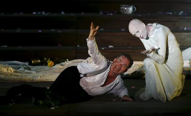 Actors Cornelius Obonya as Jedermann (L) and Peter Lohmeyer as Tod perform on stage during a dress rehearsal of Hugo von Hofmannsthal's drama “Jedermann” (Everyman) at Domplatz square in Salzburg, Austria, July 16, 2015. (Photo by Leonhard Foeger/Reuters)