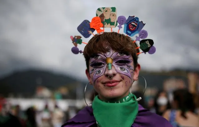 A woman participates in a rally during International Women's Day celebrations in Bogota, Colombia on March 8, 2022. (Photo by Luisa Gonzalez/Reuters)