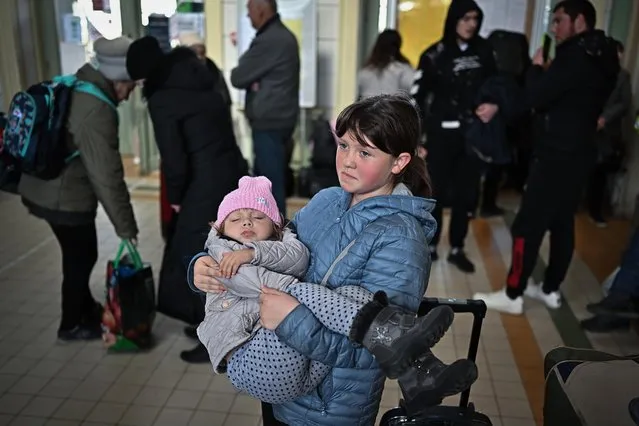 People, mainly women and children, pass through Przemysl train station after fleeing from war-torn Ukraine on April 04, 2022 in Przemysl, Poland. More than 4 million people have fled Ukraine since the Russian invasion of that country on Feb. 24. Millions more have been internally displaced. (Photo by Jeff J. Mitchell/Getty Images)