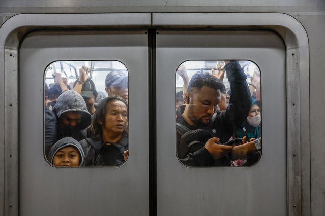 Commuters stand inside a train at Manggarai railway station in Jakarta, Indonesia, 11 July 2024. Data from the United Nations Population Fund (UNFPA) shows that Indonesia’s population reached 279.8 million in 2024. Observed annually on July 11, World Population Day was established by the Governing Council of the United Nations Development Program in 1989 to raise awareness of global population issues. According to the World Population Prospects 2024: Summary of Results, it is expected that the world’s population will peak in the mid-2080s, growing over the next sixty years from 8.2 billion in 2024 to around 10.3 billion people in the mid-2080s, and then return to 10.2 billion people by the end of the century. (Photo by Mast Irham/EPA/EFE)