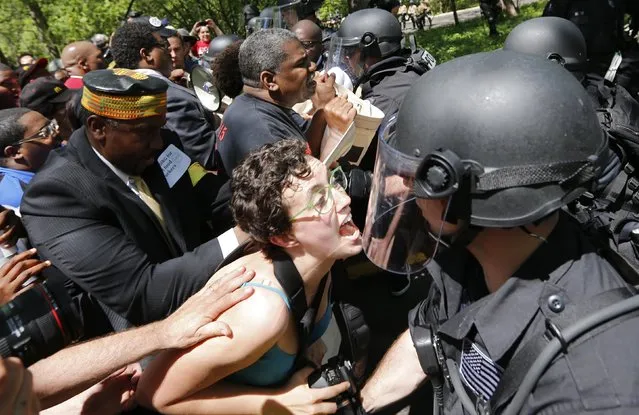 Demonstrators clash with police during a protest at McDonald's headquarters in Oak Brook, Illinois, May 21, 2014. Workers were calling for higher wages and better work conditions. (Photo by Jim Young/Reuters)
