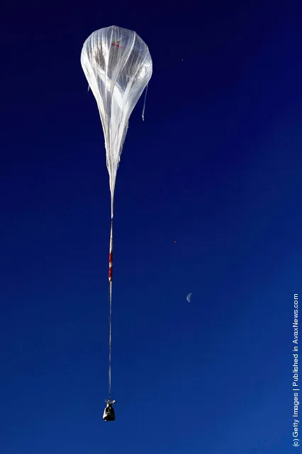 The balloon ascends during the first manned test flight for Red Bull Stratos