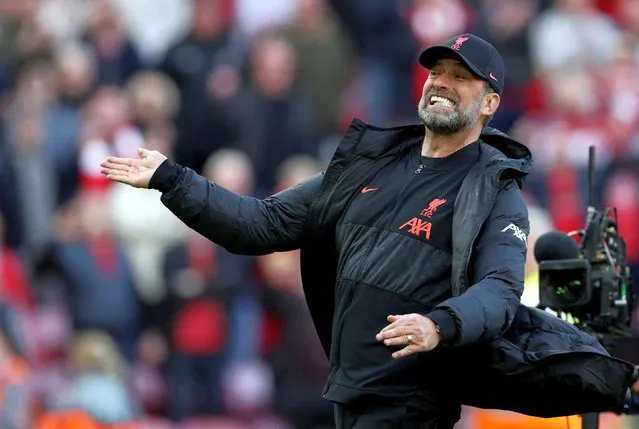 Liverpool manager Jurgen Klopp celebrates at the final whistle in front of the Kopp during the Premier League match between Liverpool and Everton at Anfield on April 24, 2022 in Liverpool, United Kingdom. (Photo by Phil Noble/Reuters)