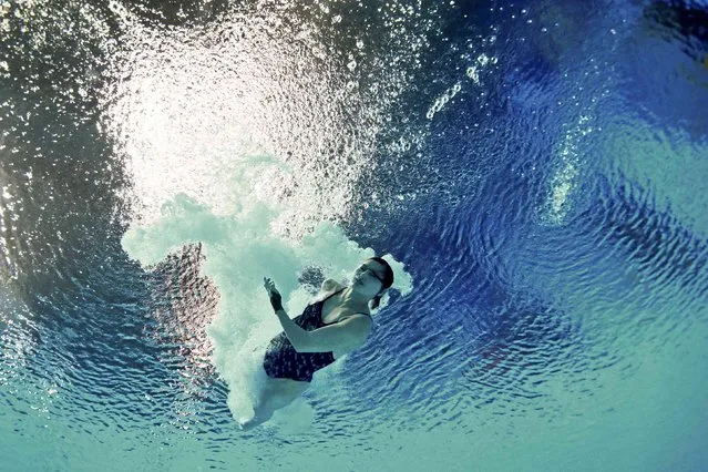 China's Si Yajie is seen underwater during the women's 10m platform preliminary event at the Aquatics World Championships in Kazan, Russia July 29, 2015. (Photo by Stefan Wermuth/Reuters)