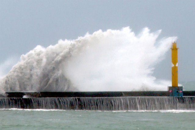 Waves crash onto the coastline before typhoon Gaemi makes landfall in northeastern Taiwan's Yilan county on Wednesday, July 24, 2024. Taiwan has shuttered offices, schools and tourist sites across the island ahead of a powerful typhoon due to make landfall later Wednesday. (Photo by Johnson Lai/AP Photo)