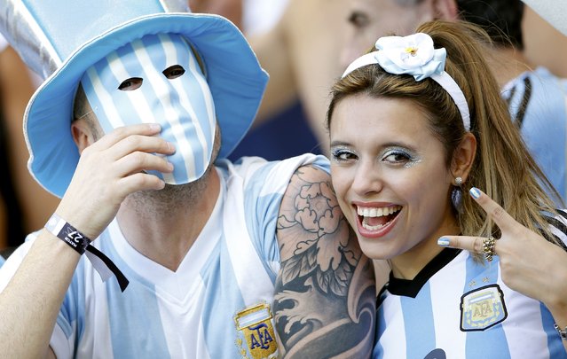 Argentina fans cheer before the 2014 World Cup Group F soccer match between Argentina and Iran at the the Mineirao stadium in Belo Horizonte June 21, 2014. (Photo by Sergio Perez/Reuters)