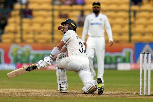 The ball hits the helmet of New Zealand's Will Young as he attempts to play a shot on a delivery by India's Ravindra Jadeja during the day five of the first cricket test match between India and New Zealand at the M.Chinnaswamy Stadium, in Bengaluru, India, Sunday, October 20, 2024. (Photo by Aijaz Rahi/AP Photo)