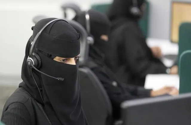 Saudi policewomen receive calls at the the Saudi National Center for Security Operations, 911, ahead of the Hajj pilgrimage in the Muslim holy city of Mecca, Saudi Arabia, Saudi Arabia, Monday, July 4, 2022. (Photo by Amr Nabil/AP Photo)