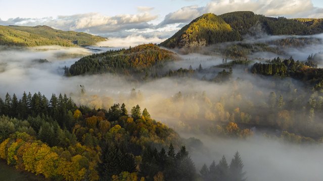 An autumnal early morning mist hovers over the village of Dunkeld in Scotland on October 17, 2024. (Photo by Euan Cherry/The Times)