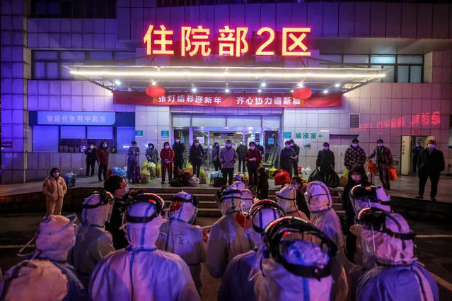 Patients (back) infected by the COVID-19 coronavirus wait to be transferred from Wuhan No.5 Hospital to Leishenshan Hospital, the newly-built hospital for the COVID-19 coronavirus patients, in Wuhan in China's central Hubei province on March 3, 2020. Across the world, 3,127 people have died from the new virus. More than 92,000 have been infected in 77 countries and territories, according to AFP's latest toll based on official sources at 1100 GMT on March 3. (Photo by AFP Photo/China Stringer Network)
