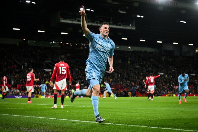 Nottingham Forest's New Zealand striker #11 Chris Wood celebrates after scoring his team third goal during the English Premier League football match between Manchester United and Nottingham Forest at Old Trafford in Manchester, north west England, on December 7, 2024. (Photo by Oli Scarff/AFP Photo)