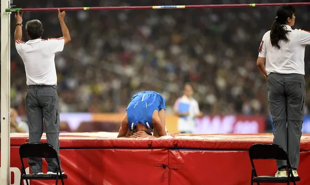 Gianmarco Tamberi of Italy reacts as the officials reset the bar in the men's high jump final during the 15th IAAF World Championships at the National Stadium in Beijing, China, August 30, 2015. (Photo by Dylan Martinez/Reuters)