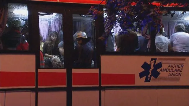 A screen grab taken from video footage shows people being evacuated onto a bus following a shooting rampage at the Olympia shopping mall in Munich, Germany July 22, 2016. (Photo by Reuters/Reuters TV)