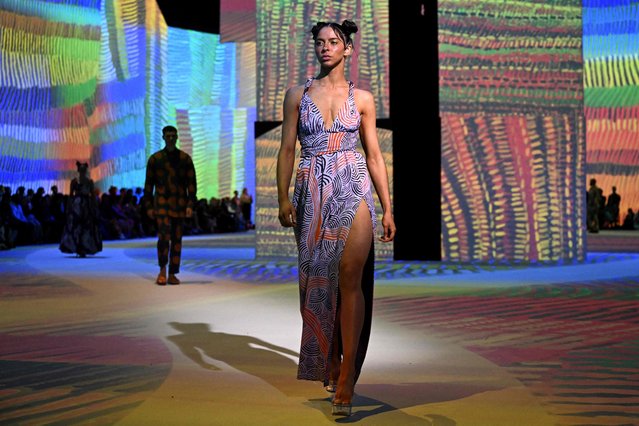 A model parades an outfit by Australian indigenous label Ikuntji Artists on the Ganbu Marra runway during the Melbourne Fashion Week in Melbourne on October 24, 2023. (Photo by William West/AFP Photo)
