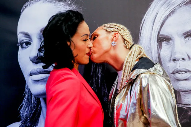 Swedish boxer Mikaela Lauren (R) kisses boxer Cecilia Braekhus of Norway during a news conference, ahead of their Oslofjord Fight Night in Oslo, Norway on October 17, 2017. (Photo by Orn E. Borgen/Reuters/NTB Scanpix)