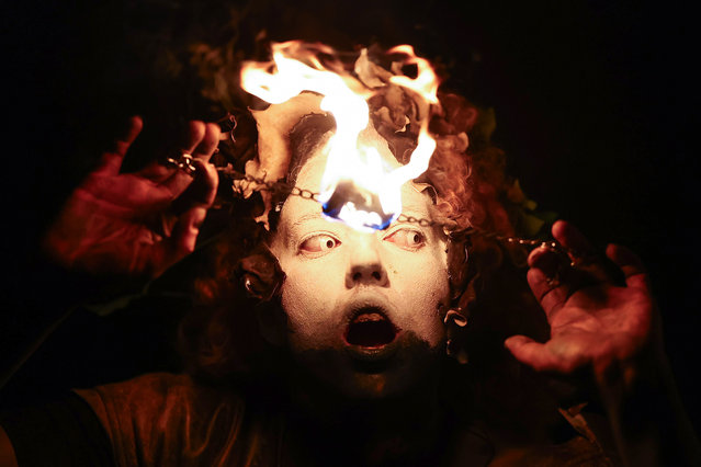 Performers take part in a procession as part of the Samhuinn Fire Festival on October 31, 2024 in Edinburgh, Scotland. The Samhuinn Fire Festival is a modern take on an ancient Celtic festival, marking the transition between summer and winter with fire-dancing, drums, acrobatics, and theatre performances. (Photo by Jeff J. Mitchell/Getty Images)