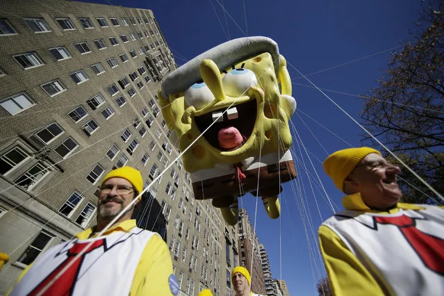 A Spongebob Squarepants balloon moves down the parade route at the 91st Macy's Thanksgiving Day Parade in New York City on November 23, 2017. (Photo by John Angelillo/UPI/Barcroft Images)