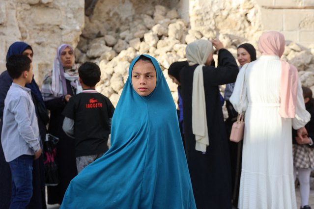 Palestinians arrive to attend Eid al-Fitr prayers, which marks the end of the holy fasting month of Ramadan, at Gaza City's historic Omari Mosque on March 30, 2025. (Photo by Omar Al-Qattaa/AFP Photo)